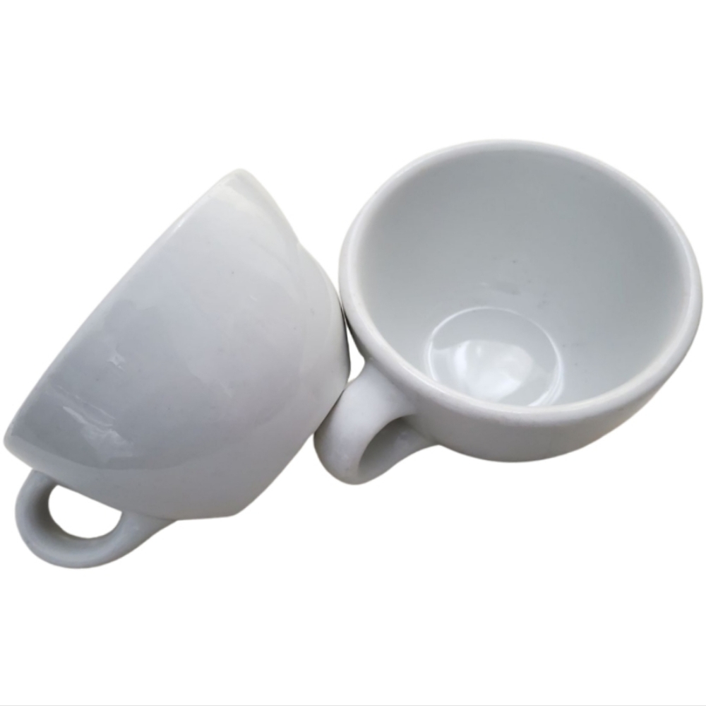 Jackson stoneware restaurant wear. Heavy white cups. Holds 8 oz. Liquid.